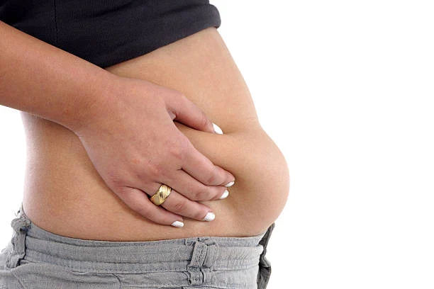 First: Surgical Tummy Tuck